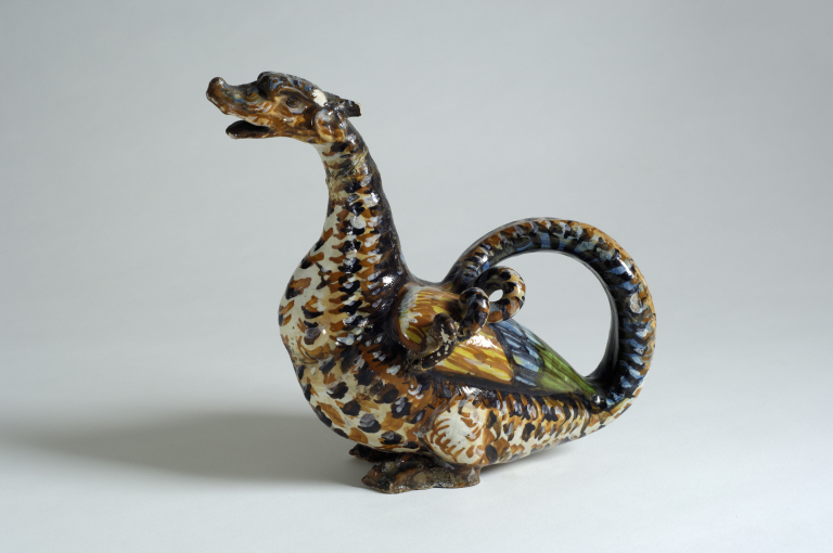 Wyvern  Italy, c.1500-1600. Majolica or Earthenware pottery A Wyvern is a type of mythical creature, similar to a dragon with two legs, two wings, and a pointed tail. An unusual creature, it is often referenced in European folklore and mythology. This piece has kept its colour well, considering its age - this is due to the type of tin glaze that has been used on the pottery.