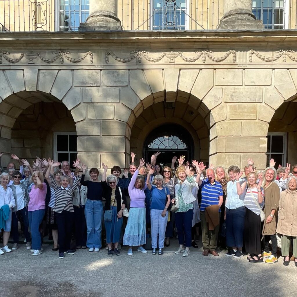 Many volunteers standing outside the exterior of the Holburne museum