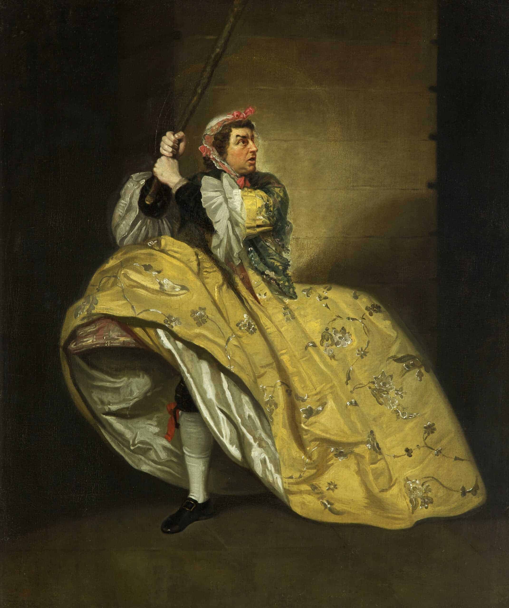 Painting showing a famous actor of the 18th century in a scene from John Vanbrugh's comedy 'The Provok'd Wife,' in which he steals his wife's clothes and is now resisting arrest. He is wearing a yellow dress and bonnet, holding a club in his hands.