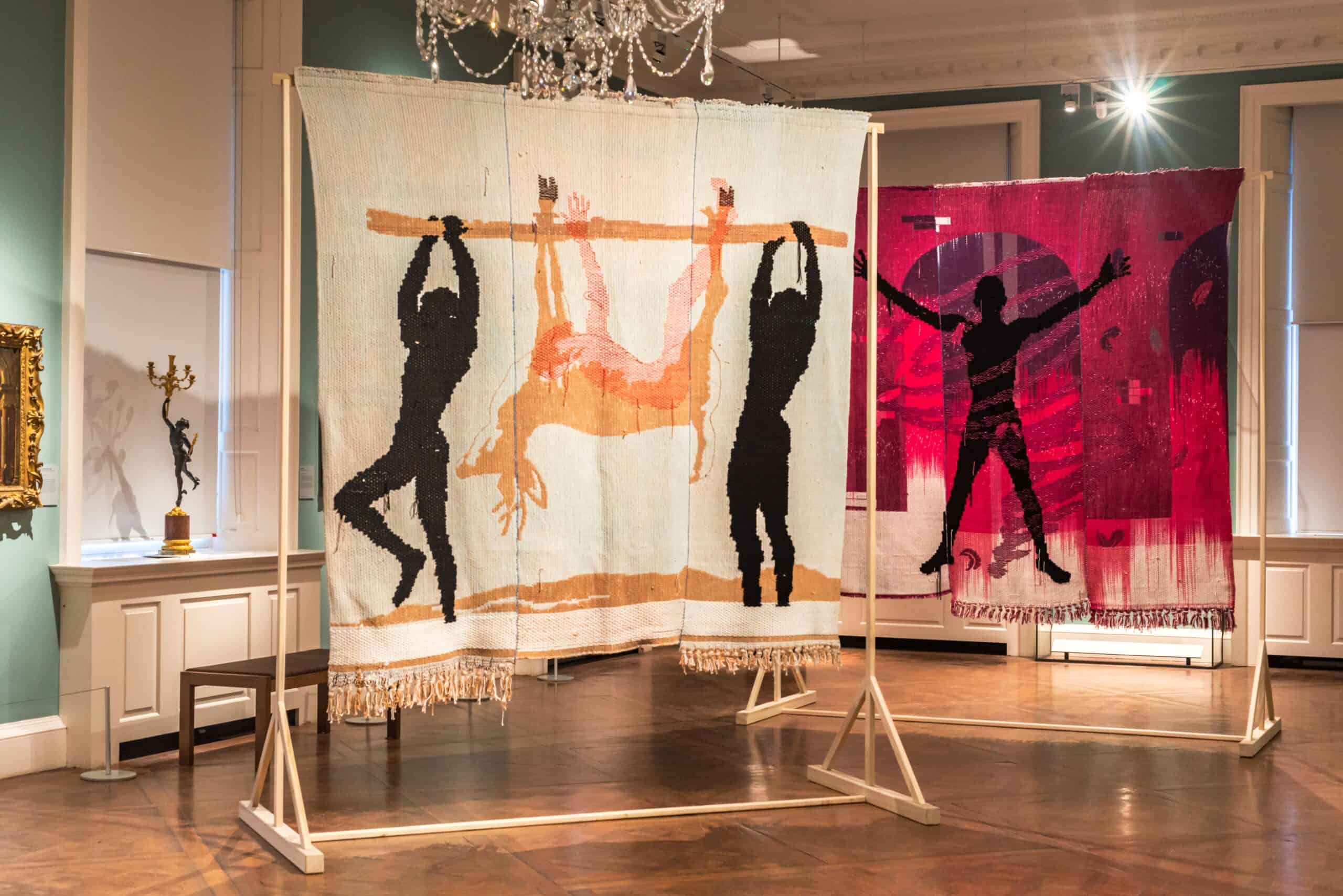 Two large hanging tapestries in the ballroom