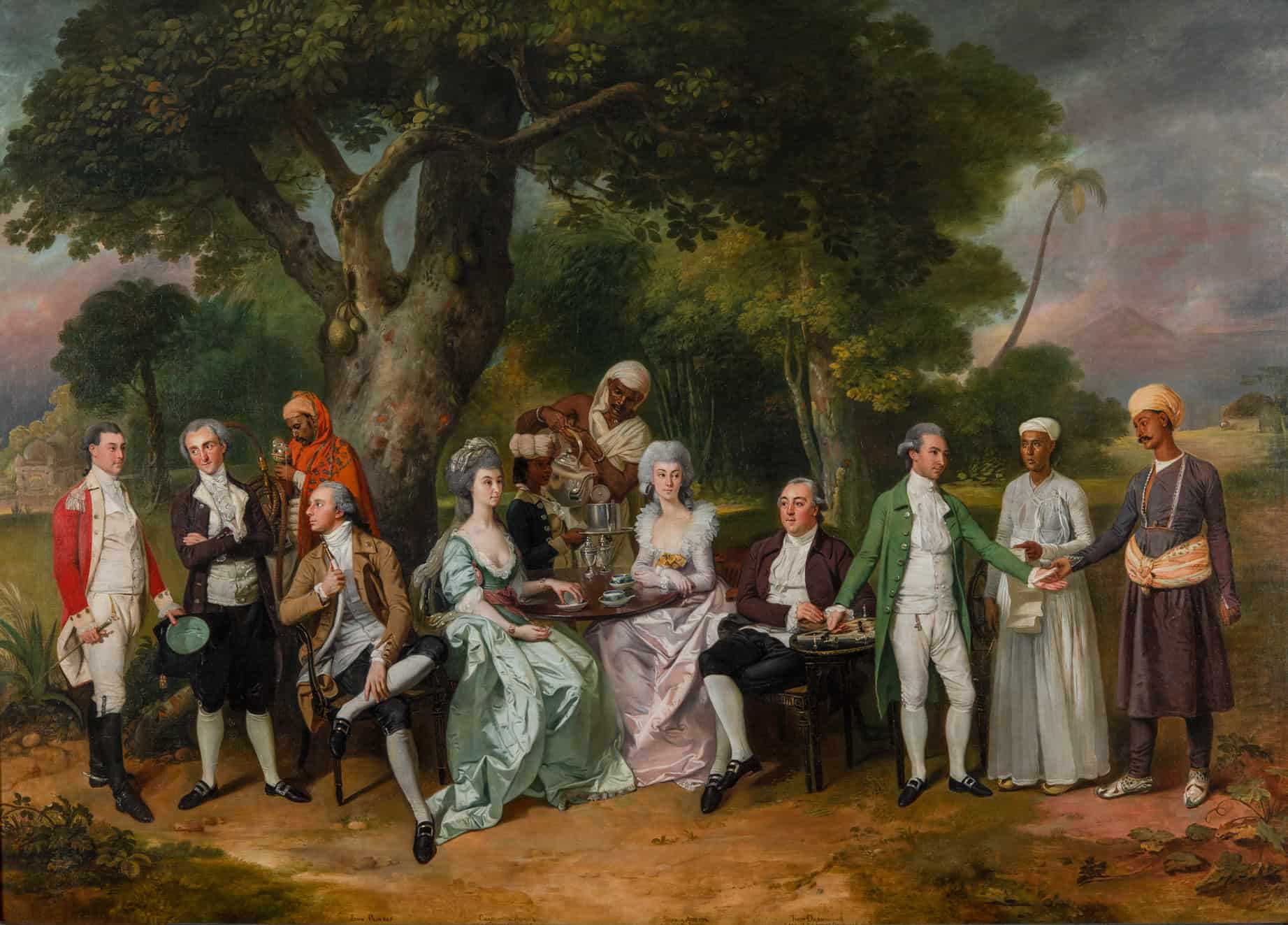 Painting showing a family group sitting under a tree being served drinks