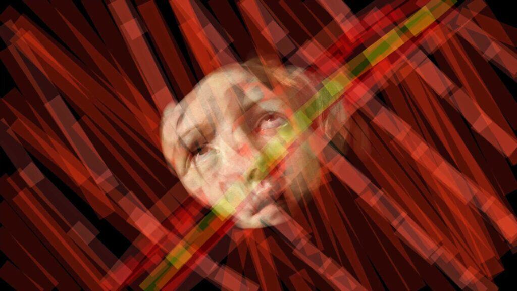 A face emerging from may red layers