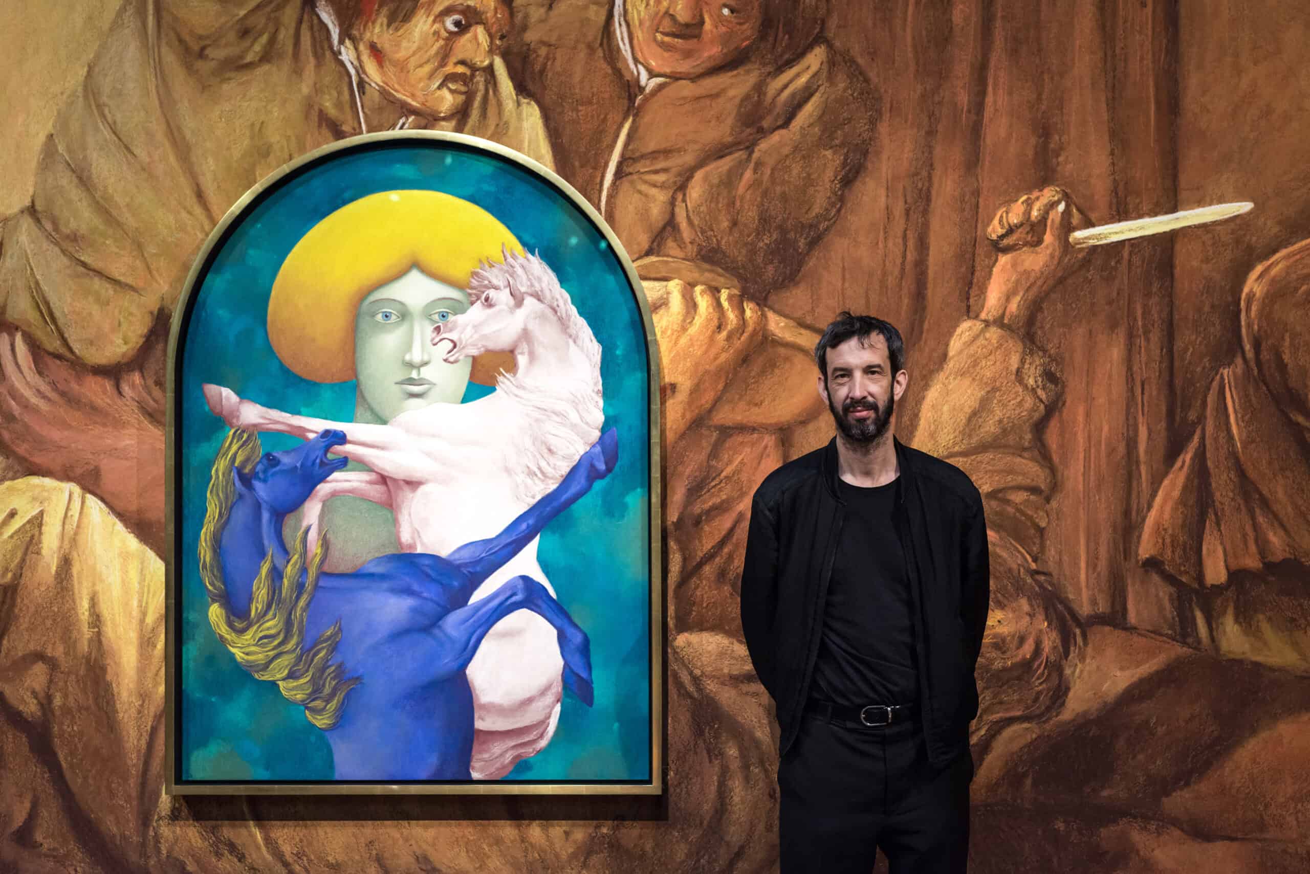 Nicolas Party the artist standing by his Holburne mural