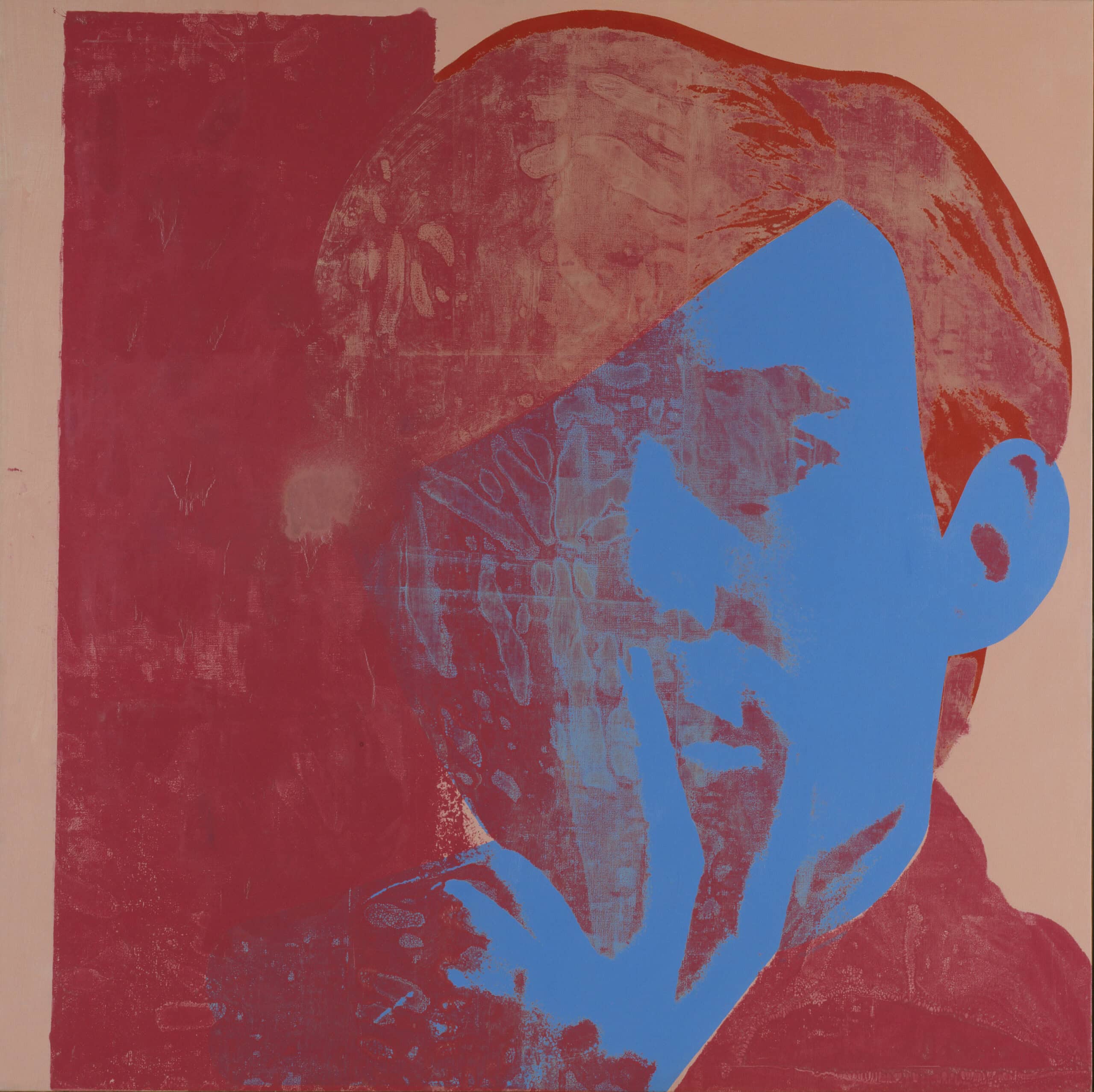 A man with red hair and a blue face