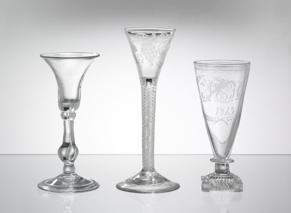 a photograph of three ale glasses of different sizes and shapes.