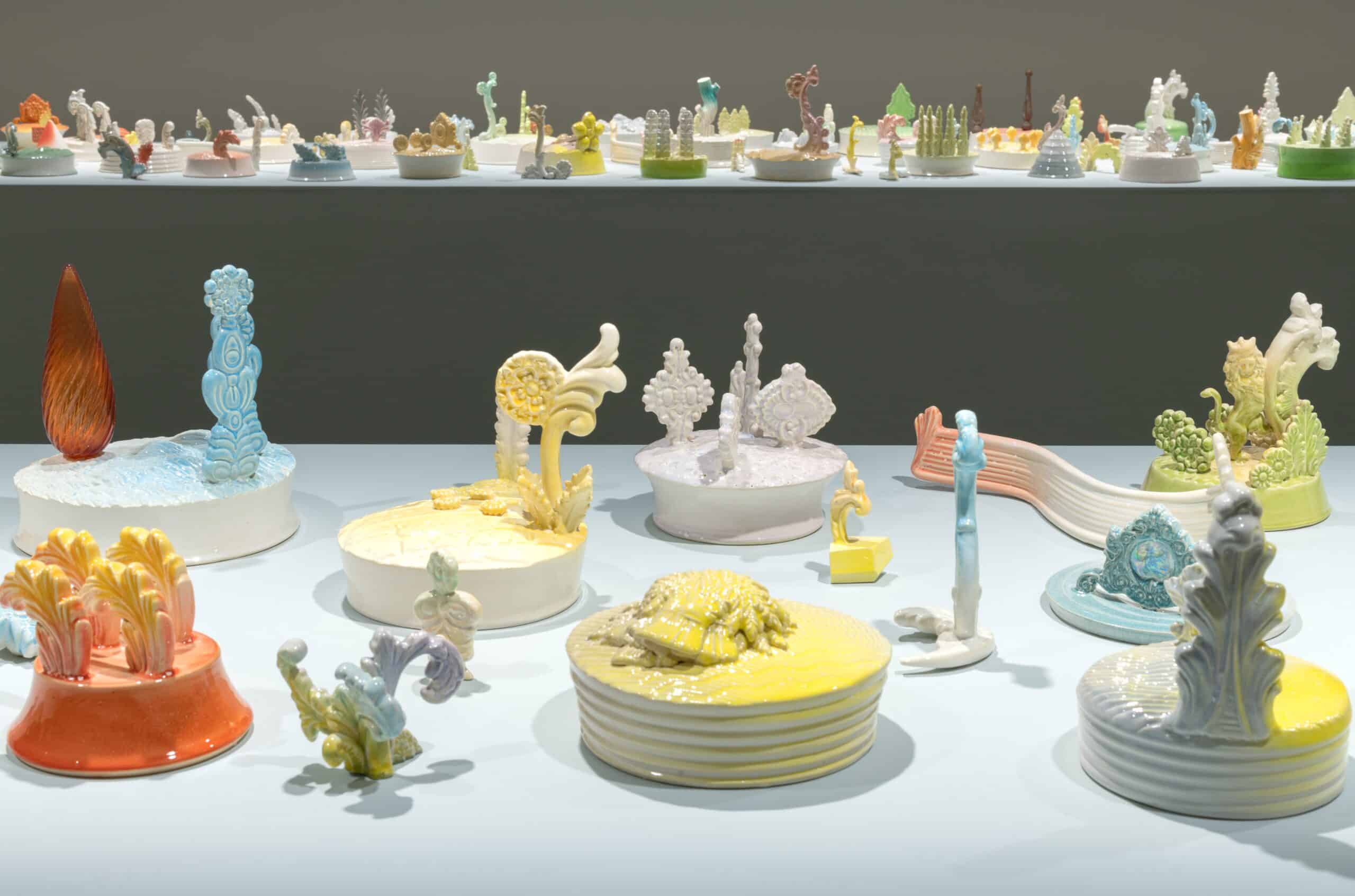 Photo showing an array of pastel coloured ceramic forms set out on a table