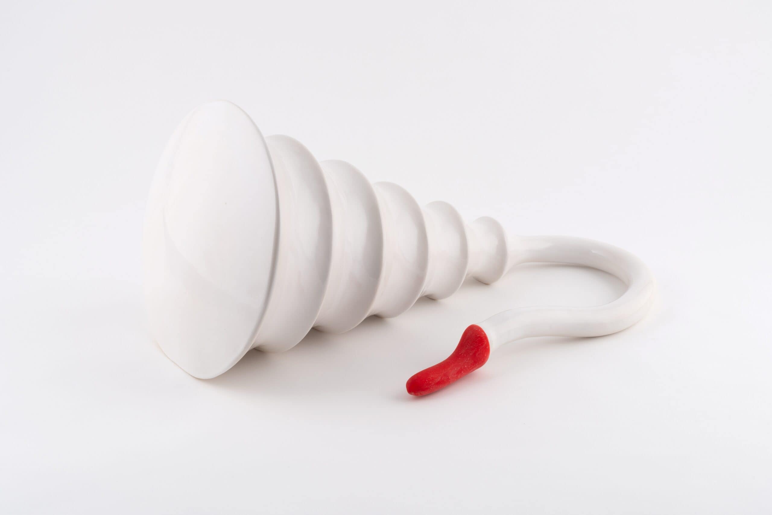 Glazed ceramic with latex in the shape of a abstract swan.