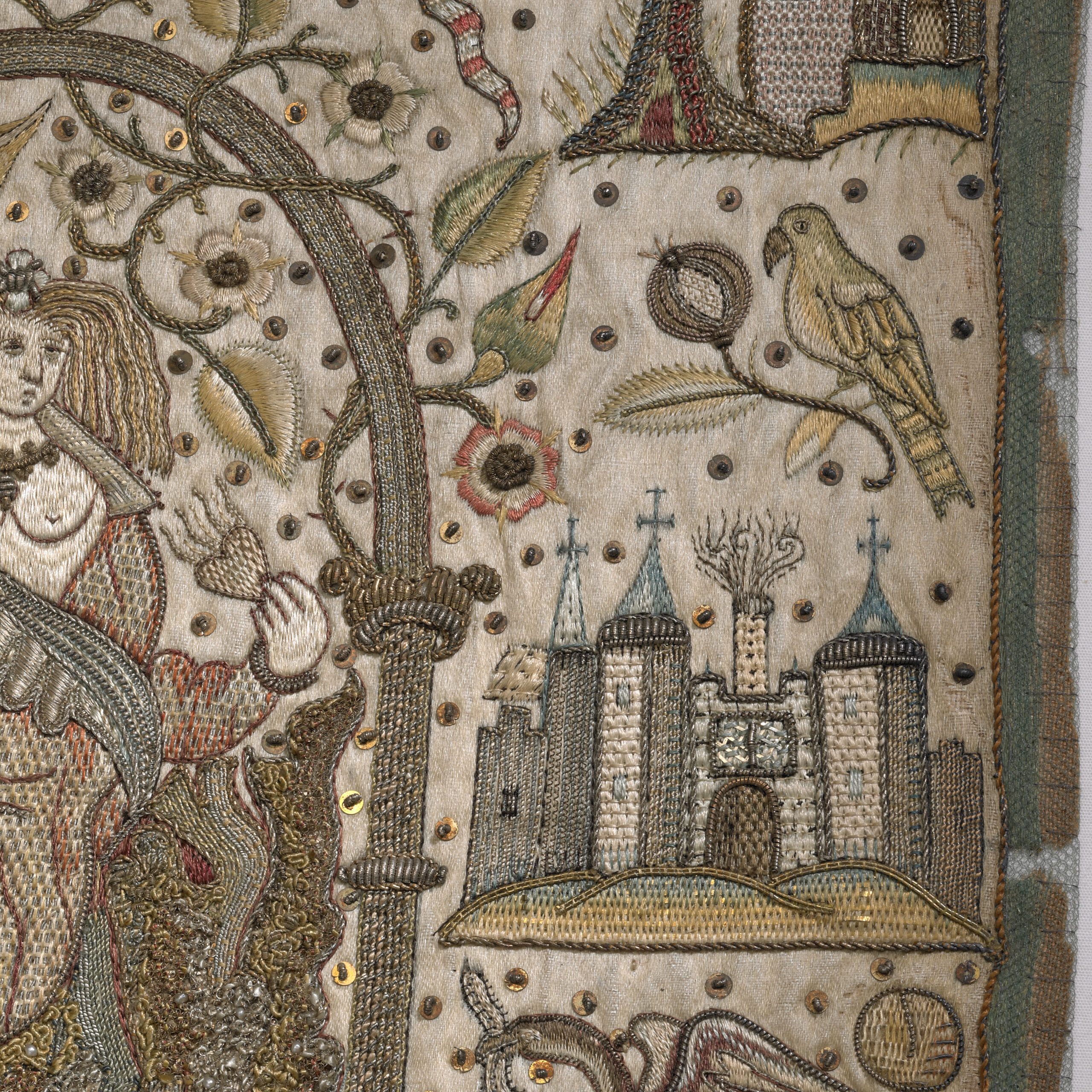 Close up of detailed embroidery of a bird and a castle